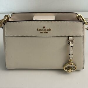 kate spade cream crossbody with gold charm and hardware